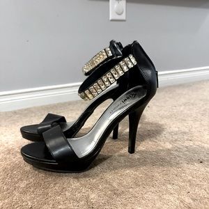 Open toe heeled sandals.